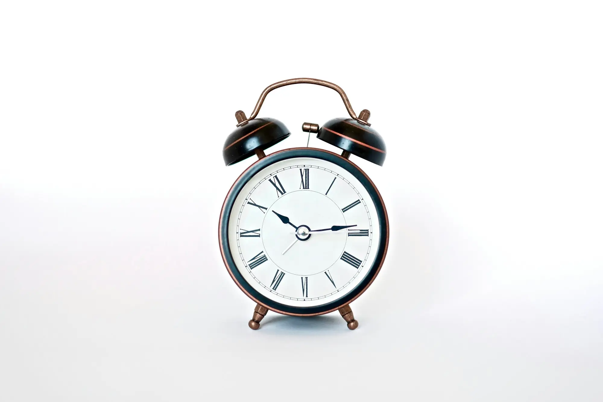 Round black and white alarm clock
