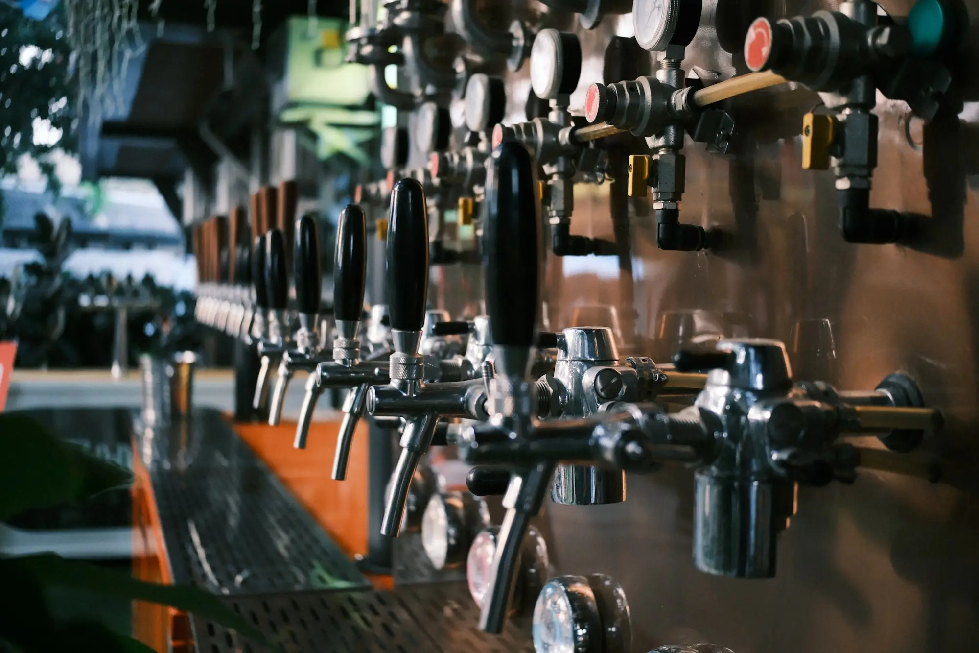 Row of beer taps at a bar