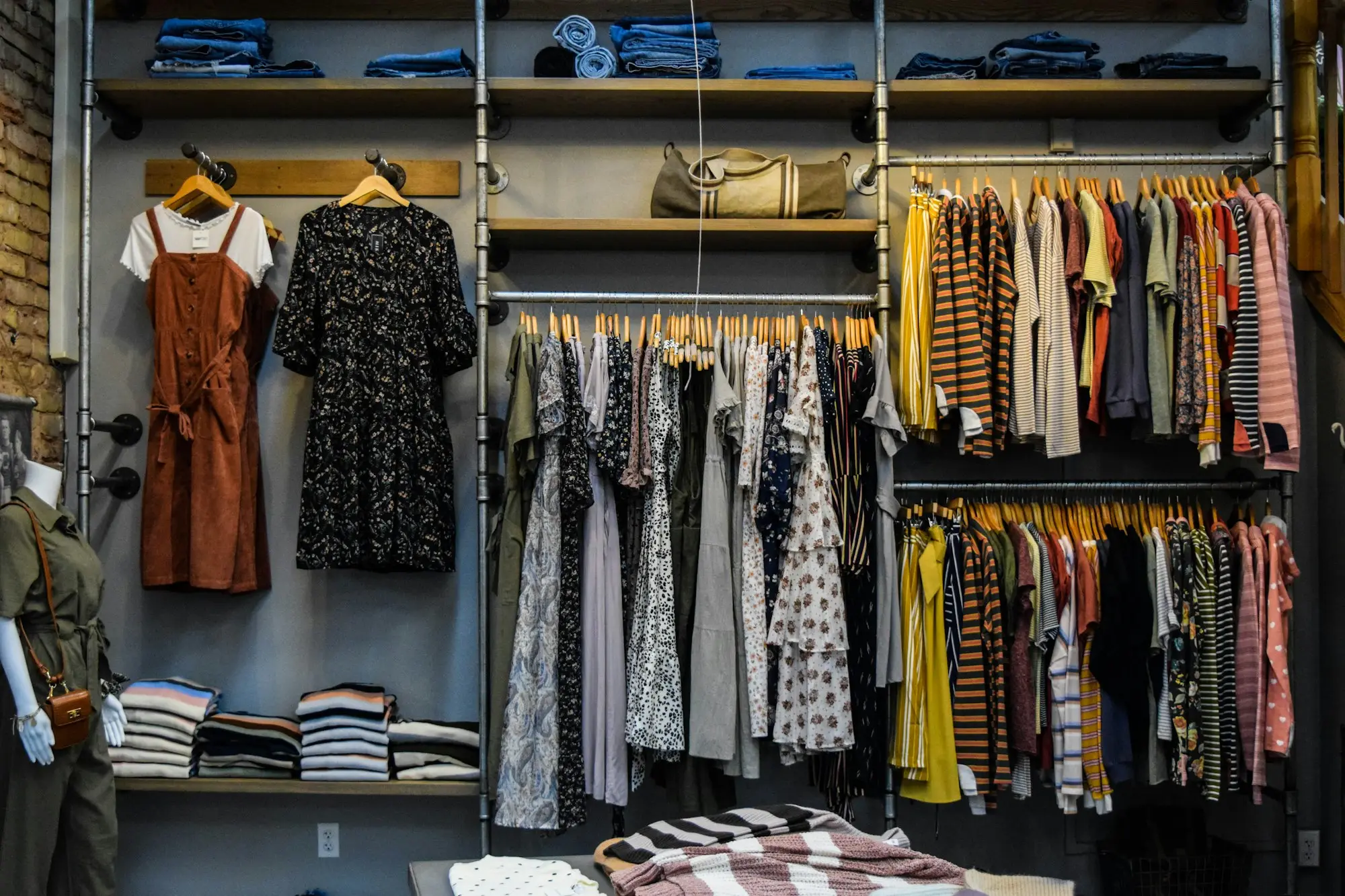 Racks of colourful clothes in a boutique