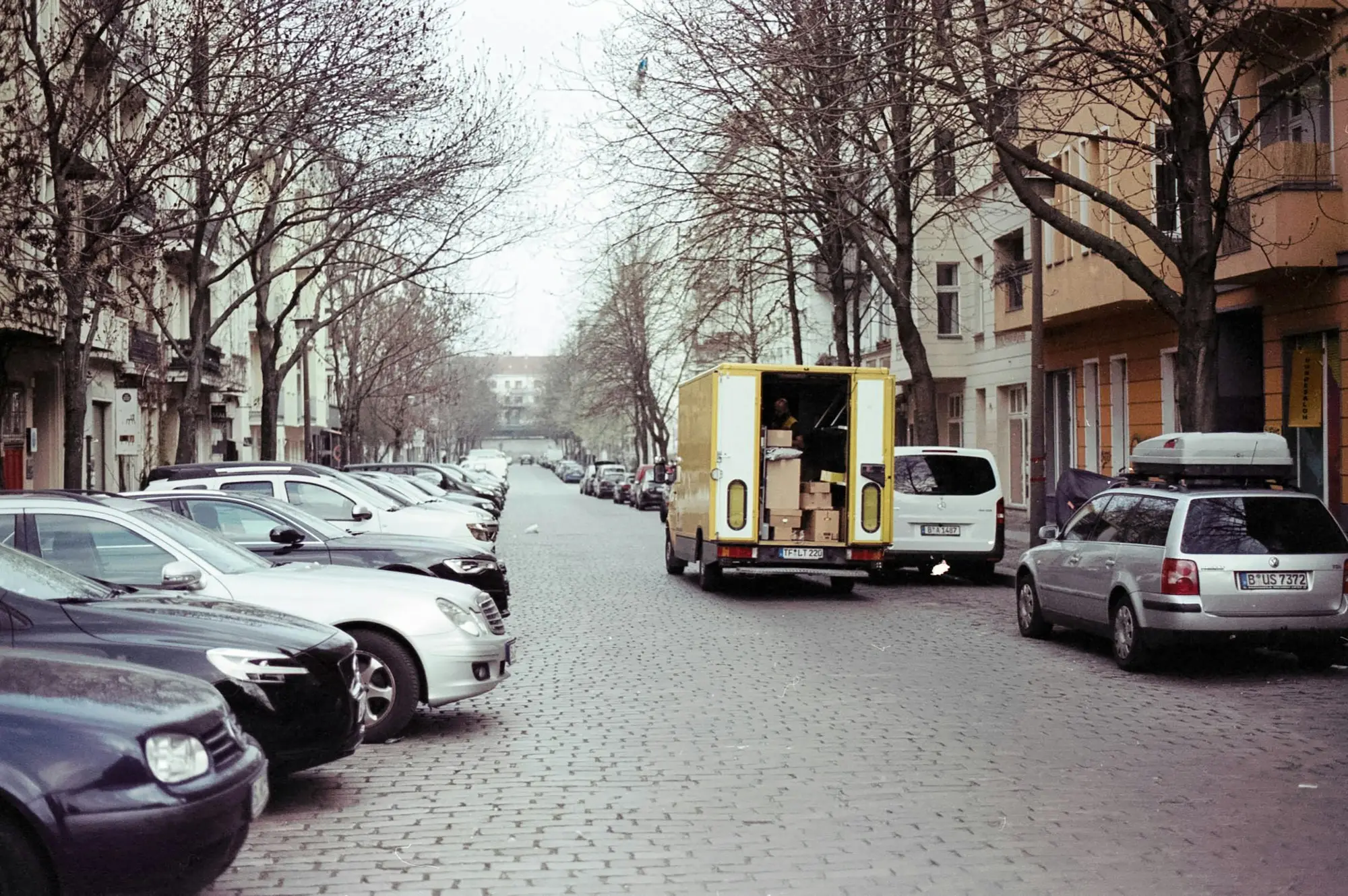 Delivery truck parked on the side of the road