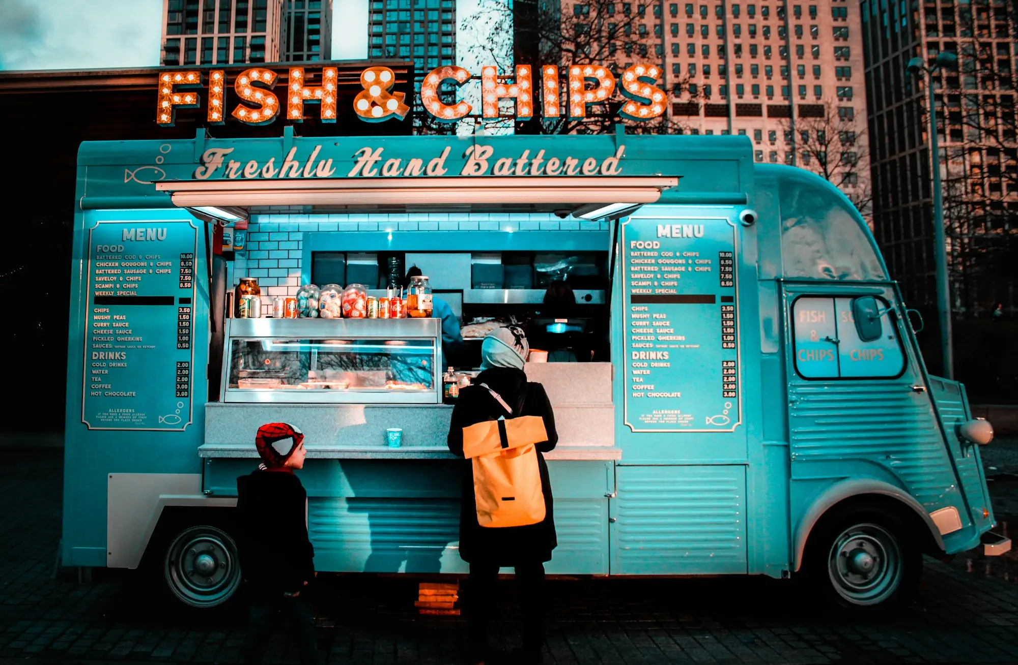 Owner standing in front of a food stall