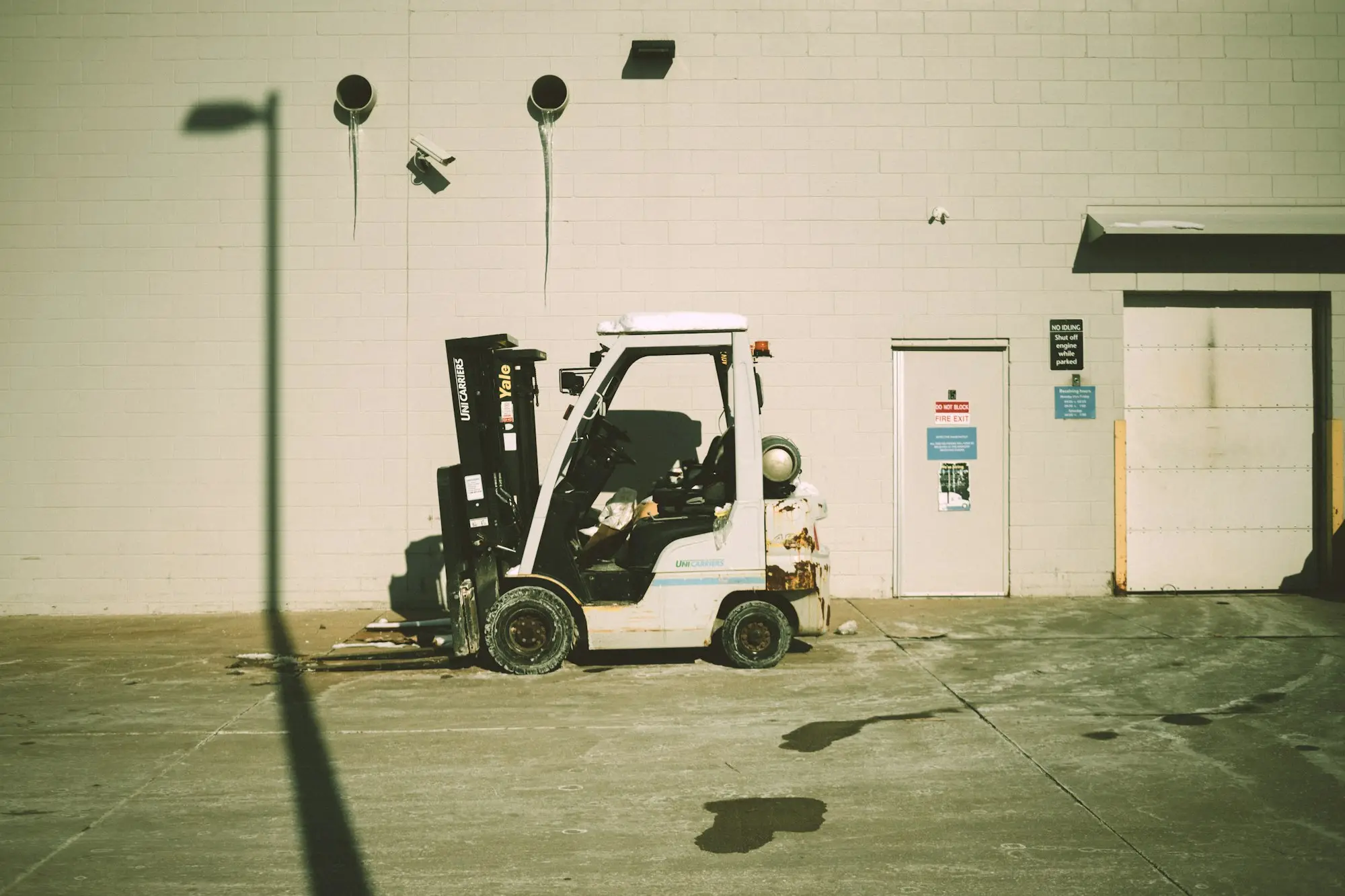 Forklift parked outside a warehouse