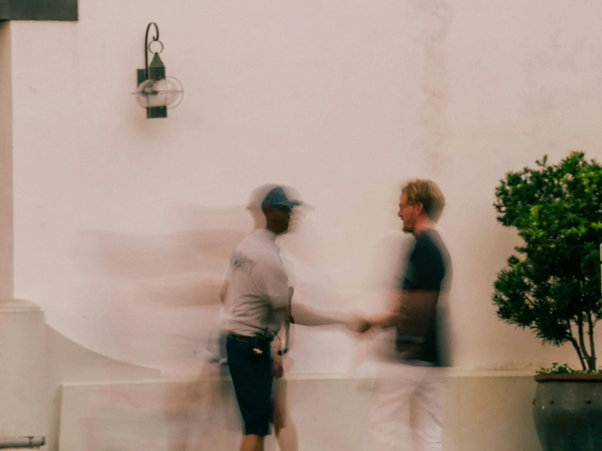 Two people shaking hands to agree a business deal