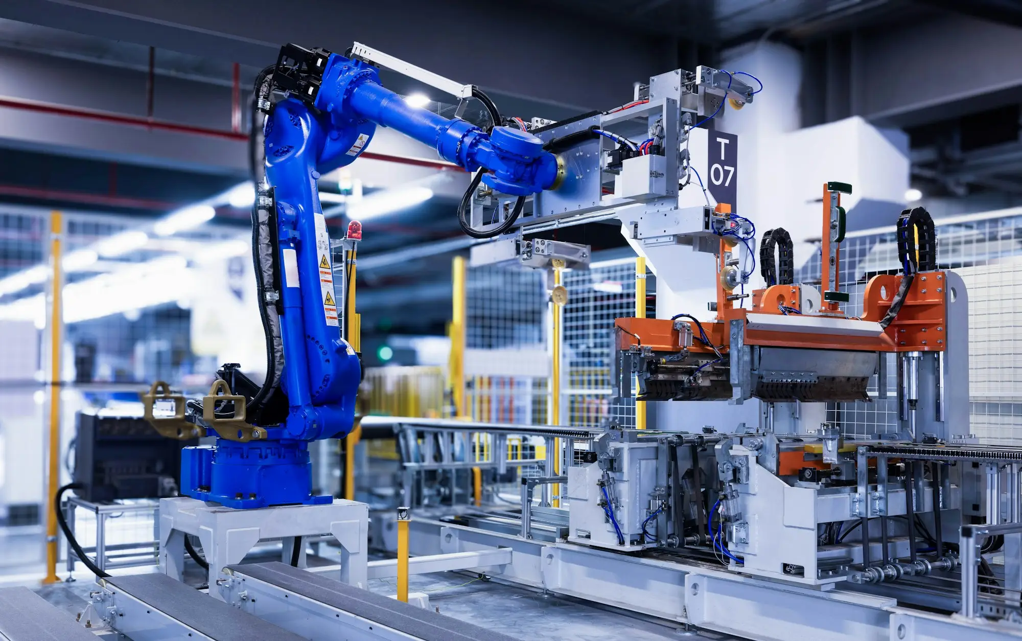 Industrial robot arm in a factory