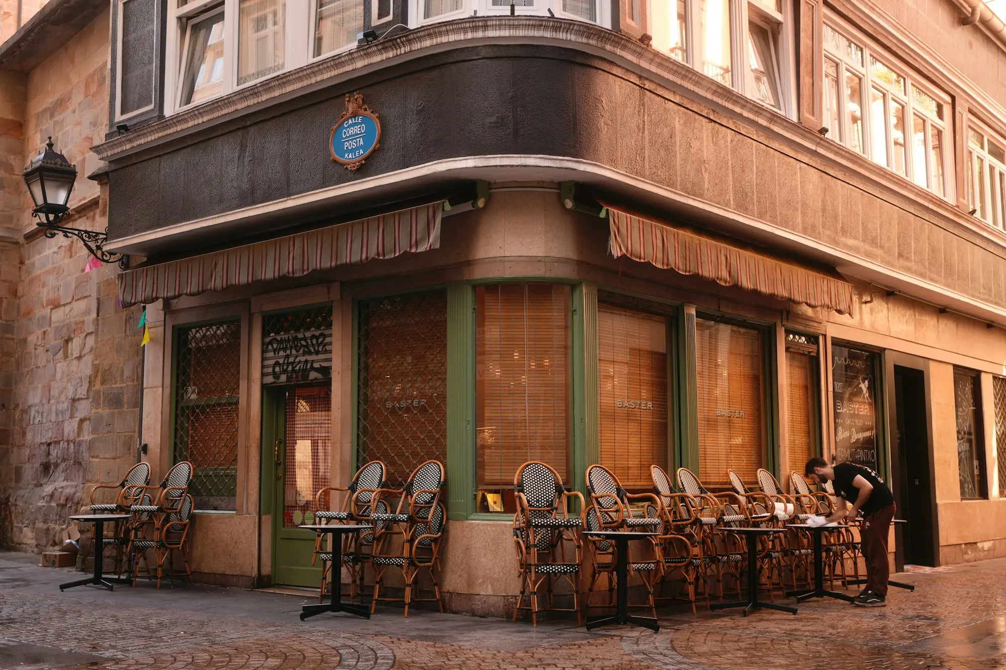 Outdoor cafe seating in front of a heritage building