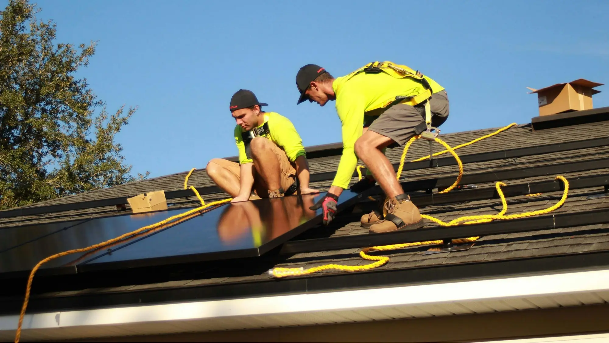 Installers working on a roof